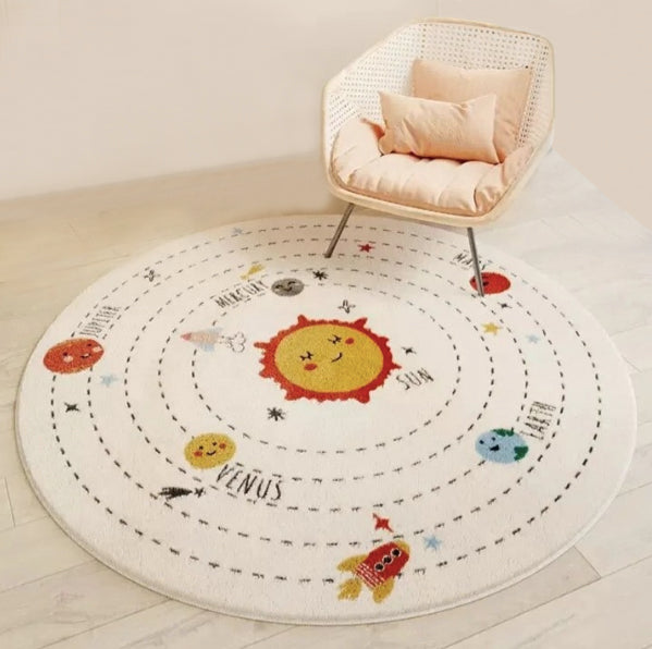 Bring a cheerful touch to your little one's playroom with this soft and durable polyester space rug! Its vibrant modern look will light up the room - and both you and your kids will love the cozy comfort of its polyester fibers beneath your feet!
