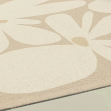 Load image into Gallery viewer, This taupe daisy rug is the perfect option for your child&#39;s bedroom. Made from high-quality polyester, it&#39;s designed to last while providing a modern, minimalistic aesthetic. Soft yet durable, it comes in multiple colors and is easy to clean, making it ideal for any home.
