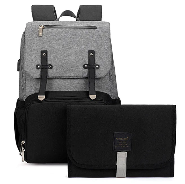 The perfect grey and Black baby diaper backpack. Expertly designed for both style and function, this backpack is an essential tool for any new parent. With a sleek grey and black color scheme, this backpack is perfect for both moms and dads. Stay organized and prepared with its spacious interior and multiple pockets for all your baby's essentials. Carry it comfortably with its ergonomic design and adjustable straps, making it the perfect accessory for any outing with your little one.