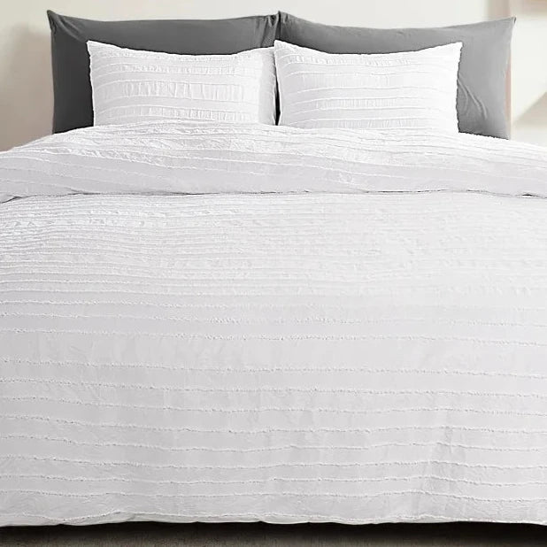 Transform your bedroom with our White Tufted Duvet Cover Set, made from the softest microfiber that replicates light fluffiness. The stunning tufted design adds a touch of beauty and elegance, perfect for layering with other cozy and tactile accessories. Available in full, queen, king, and California King sizes, this set offers amazing huggable softness for you to indulge in. Ignite your senses and elevate your sleep experience with this must-have product!