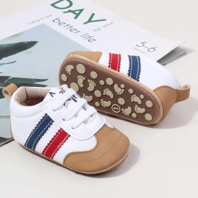 Designed with expert precision, these baby sneakers are crafted to fit children aged newborn through 18 months old with ultimate comfort and style.