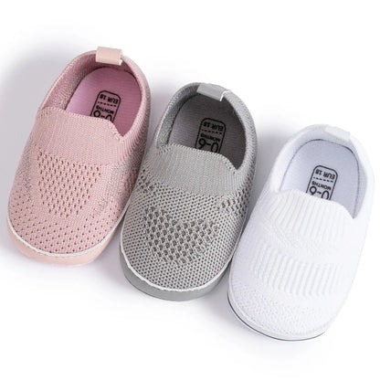 Easily breathable and featherlight infant shoes in shades of pink, white, and grey; perfect for newborns up to 18 months of age.