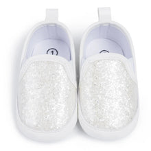 Load image into Gallery viewer, Not only will your little angel look fashionable in these stylish gold, silver and white baby loafers, but they will also stay safe and comfortable with their anti-slip, soft-sole design. Perfect for newborns up to 18 months, these shoes are easy to put on and take off, making your life as a busy parent a little easier. Provide your child with both fashion and function with our sparkling loafers in multiple colors and sizes.
