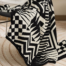 Load image into Gallery viewer, This ultra-cute geometric blanket is exactly what your kid&#39;s bedroom needs to be bursting with vibrancy! Keep &#39;em snug and stylish with this cozy knitted throw that&#39;s available in beautiful black and white. Snuggle up!  Size: 51.18 x 62.99 inches (130cm x 160cm) Material: 100% cotton Feature: Anti-pilling.
