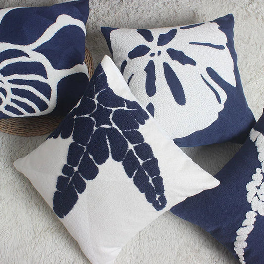 Transform your child's bedroom or playroom into an ocean paradise with these beautifully embroidered navy and white pillows. Each design is perfect for your little sea lover and will add a touch of coziness and style to their space. Bring the wonders of the ocean to life with these must-have pillows!