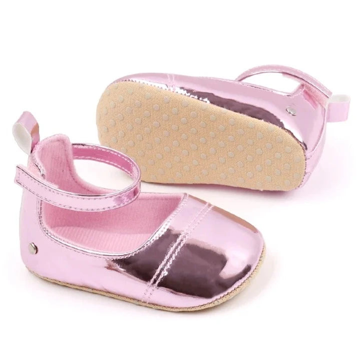 The perfect first time walker shoes for your little walker. Shower your little one's feet with style and comfort with our Bling Baby Shoes | Multiple Colors! Designed for newborns to 18 months, these shoes are perfect for your child's first steps. Supportive and durable, they'll keep your little walker's feet protected as they explore the world. Give them the confidence to take those first steps with our Bling Baby Shoes