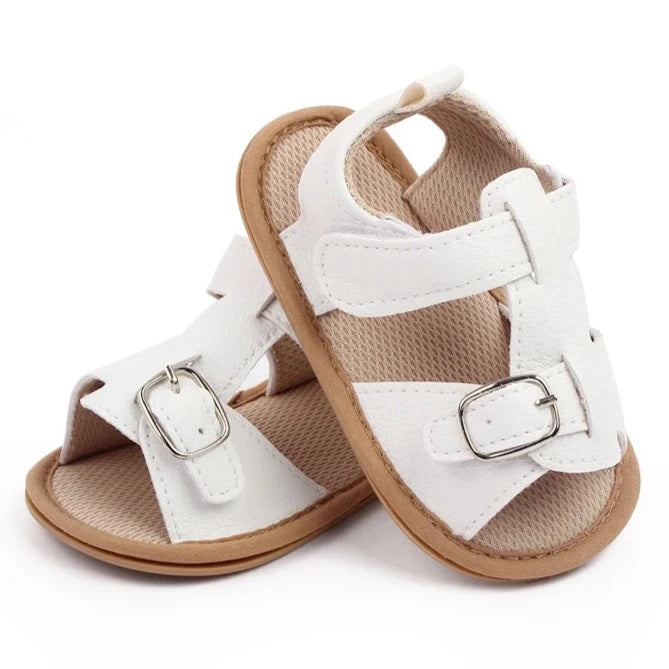 Bring comfort and style to your little one's summer with these adorable sandals in vibrant yellow, crisp white, and cool blue. Perfect for newborns to 18-month-olds, these sandals will have your baby looking cute from every angle. Elevate your baby's style with these adorable and versatile sandals! Keep your little one's feet cool and comfortable all summer long with these must-have sandals