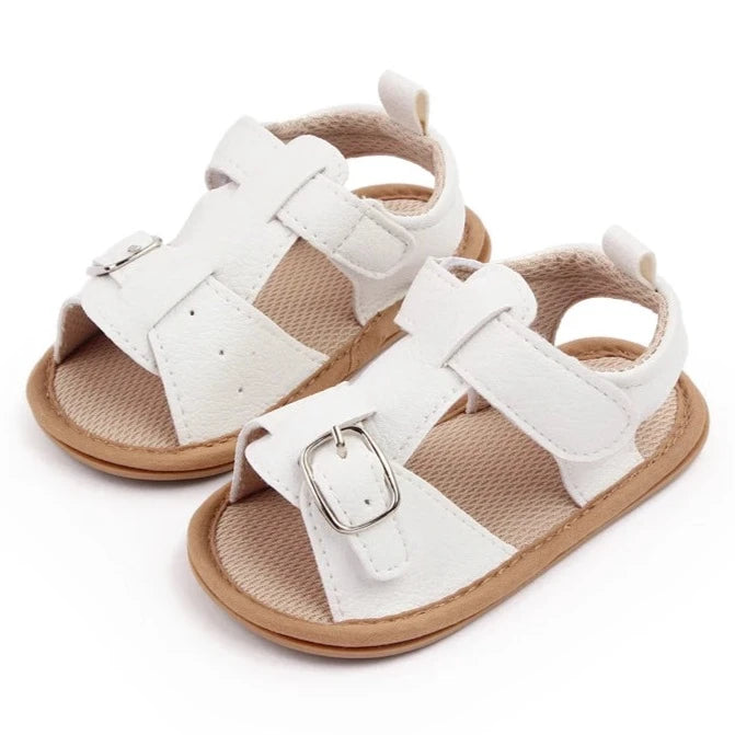 Bring comfort and style to your little one's summer with these adorable sandals in vibrant yellow, crisp white, and cool blue. Perfect for newborns to 18-month-olds, these sandals will have your baby looking cute from every angle. Elevate your baby's style with these adorable and versatile sandals! Keep your little one's feet cool and comfortable all summer long with these must-have sandals