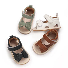 Load image into Gallery viewer, Indulge your little one in the ultimate comfort with our Valentina Baby Sandals, available in a variety of vibrant colors including green, black, white, and brown. Perfect for newborns up to 18 months, these stylish sandals are sure to make a statement and keep your baby&#39;s feet looking and feeling great..
