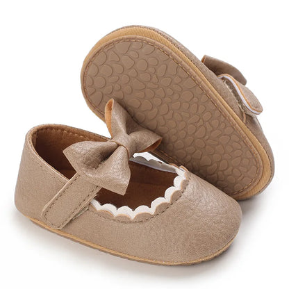 Indulge your little one's feet with our adorable Mary Jane baby shoes in a selection of sweet colors. Perfect for newborns through 18 months old, choose from white, black, apricot, and brown to match any outfit.