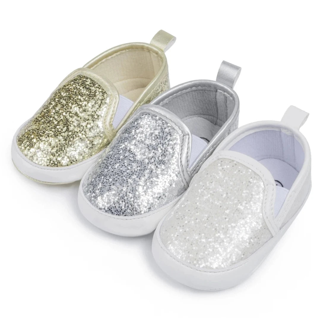 Not only will your little angel look fashionable in these stylish gold, silver and white baby loafers, but they will also stay safe and comfortable with their anti-slip, soft-sole design. Perfect for newborns up to 18 months, these shoes are easy to put on and take off, making your life as a busy parent a little easier. Provide your child with both fashion and function with our sparkling loafers in multiple colors and sizes.