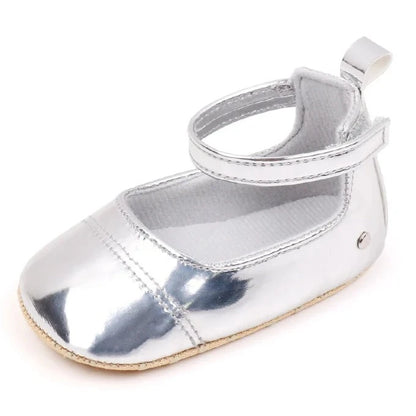 The perfect first time walker shoes for your little walker. Shower your little one's feet with style and comfort with our Bling Baby Shoes | Multiple Colors! Designed for newborns to 18 months, these shoes are perfect for your child's first steps. Supportive and durable, they'll keep your little walker's feet protected as they explore the world. Give them the confidence to take those first steps with our Bling Baby Shoes