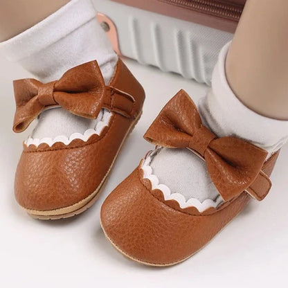 Indulge your little one's feet with our adorable Mary Jane baby shoes in a selection of sweet colors. Perfect for newborns through 18 months old, choose from white, black, apricot, and brown to match any outfit.