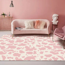 Load image into Gallery viewer, Dress your kid&#39;s bedroom floor with this cool pink cow rug! With its bold black and white pattern, you&#39;ll be able to jazz up your space with ease. Plus, it&#39;s made of polyester and is easy to clean, so you can keep it looking stylish for years to come. Get it now and bring some moo-fashion into your kid&#39;s bedroom!
