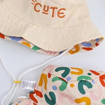 Cute two-sided beige and rainbow bucket hat. Just turn the hat around to create a different look for your child. This hat comes in 4 sizes. Strap Type: Adjustable. Material: Cotton and Polyester.    Head Circumference   18.89 inches (48cm) - Approximately 18 months to 3 years  19.68 inches(50cm) - Approximately 3 to 4 years   20.47 inches (52cm) - Approximately 4 to 5 years  21.25 inches (54cm) - Approximately 6 to 7 years