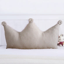 Load image into Gallery viewer, Make your little kid feel like royalty with our checkered crown headboard pillow. Crafted with cotton plaid and soft pearl cotton filler, this beautiful pillow comes in multiple sizes and colors. Add some flair to their bedroom with either the Khaki or Red! Removable and washable for easy care, they&#39;ll love having their own headboard pillow!
