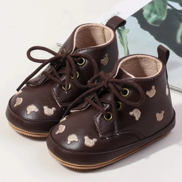 Made with the highest-quality materials, your little one's feet will stay comfortable and supported throughout their first years of growth. Available in multiple sizes, our Little Bear Baby Shoes come in a versatile palette of brown, khaki, and black, perfect for kids ages newborn to 18 months.