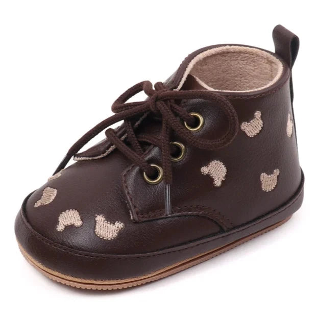 Made with the highest-quality materials, your little one's feet will stay comfortable and supported throughout their first years of growth. Available in multiple sizes, our Little Bear Baby Shoes come in a versatile palette of brown, khaki, and black, perfect for kids ages newborn to 18 months.