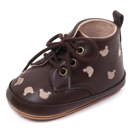 Made with the highest-quality materials, your little one's feet will stay comfortable and supported throughout their first years of growth. Available in multiple sizes, our Little Bear Baby Shoes come in a versatile palette of brown, khaki, and black, perfect for kids ages newborn to 18 months.