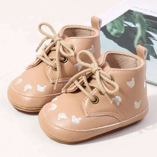 Made with the highest-quality materials, your little one's feet will stay comfortable and supported throughout their first years of growth. Available in multiple sizes, our Little Bear Baby Shoes come in a versatile palette of brown, khaki, and black, perfect for kids ages newborn to 18 months.