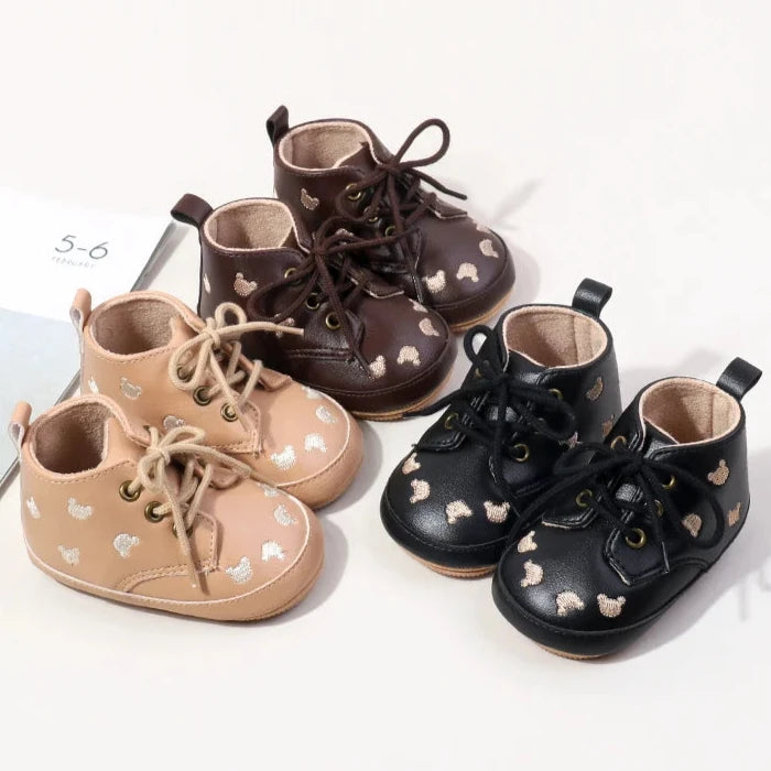 Made with the highest-quality materials, your little one's feet will stay comfortable and supported throughout their first years of growth. Available in multiple sizes, our Little Bear Baby Shoes come in a versatile palette of brown, khaki, and black, perfect for kids ages newborn to 18 months.