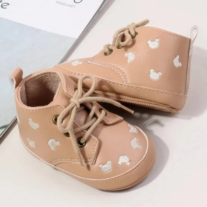 Made with the highest-quality materials, your little one's feet will stay comfortable and supported throughout their first years of growth. Available in multiple sizes, our Little Bear Baby Shoes come in a versatile palette of brown, khaki, and black, perfect for kids ages newborn to 18 months.