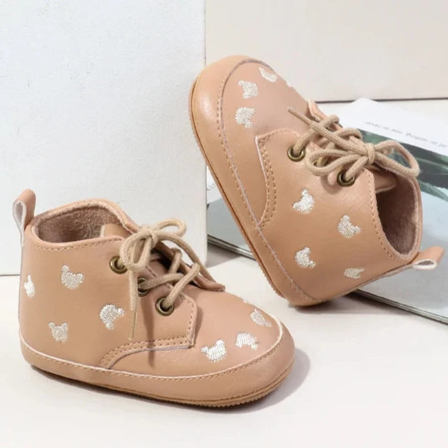 Made with the highest-quality materials, your little one's feet will stay comfortable and supported throughout their first years of growth. Available in multiple sizes, our Little Bear Baby Shoes come in a versatile palette of brown, khaki, and black, perfect for kids ages newborn to 18 months.