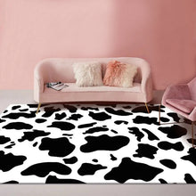 Load image into Gallery viewer, Dress your kid&#39;s bedroom floor with this cool cowhide rug! With its bold black and white pattern, you&#39;ll be able to jazz up your space with ease. Plus, it&#39;s made of polyester and is easy to clean, so you can keep it looking stylish for years to come. Get it now and bring some moo-tastic fashion into your home!
