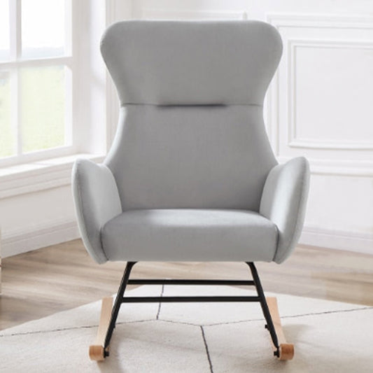 Style and comfort meet in this luxurious grey velvet rocking chair. Perfect for your nursery, it's an ideal choice to rock your little one to sleep. Enjoy the calming warmth of its cuddly texture and the elegant beauty of its modern design. Create cozy memories that will last a lifetime. Dimensions: 25.9" x 25.9" x 37.8" H