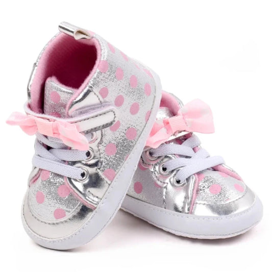Expertly designed for style and comfort. These adorable sneakers feature festive polka dots in three vibrant colors that will have your baby looking fashionable from newborn to 18 months old.