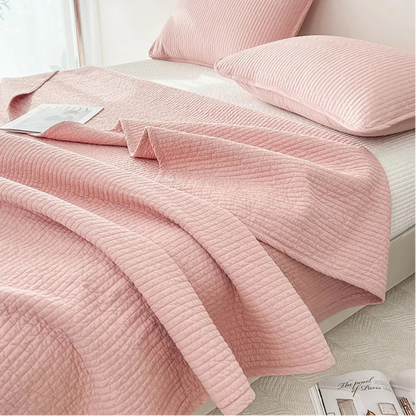 This premium pink quilt, crafted from 100% cotton with intricate embroidery, is perfect for enhancing your child's bedroom. Available in twin, full, queen, and king sizes, it offers both comfort and style tailored to your needs.