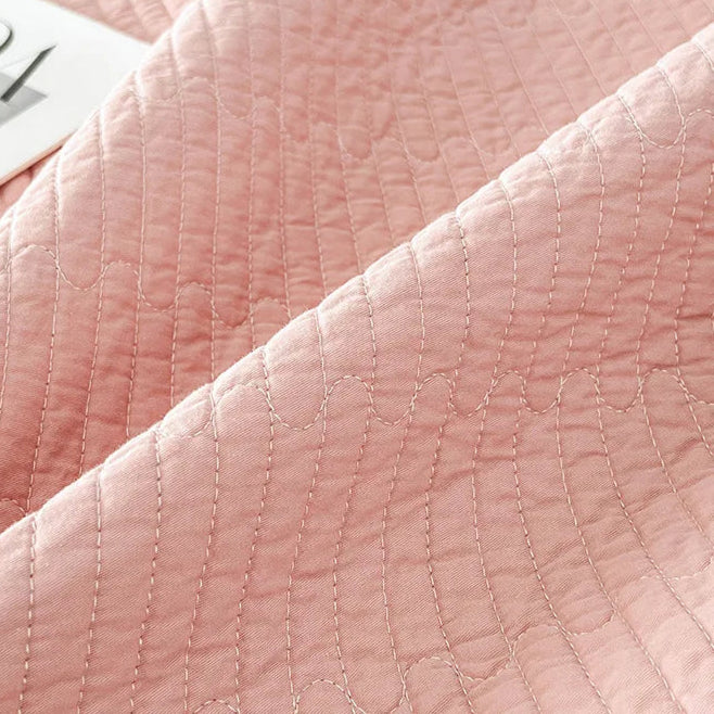 This premium pink quilt, crafted from 100% cotton with intricate embroidery, is perfect for enhancing your child's bedroom. Available in twin, full, queen, and king sizes, it offers both comfort and style tailored to your needs.