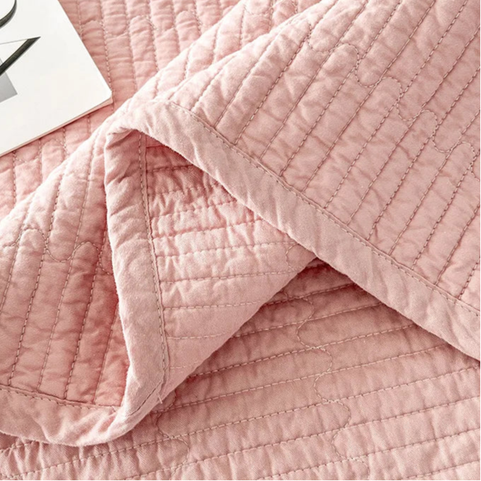 This premium pink quilt, crafted from 100% cotton with intricate embroidery, is perfect for enhancing your child's bedroom. Available in twin, full, queen, and king sizes, it offers both comfort and style tailored to your needs.