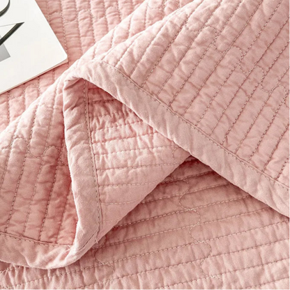 This premium pink quilt, crafted from 100% cotton with intricate embroidery, is perfect for enhancing your child's bedroom. Available in twin, full, queen, and king sizes, it offers both comfort and style tailored to your needs.