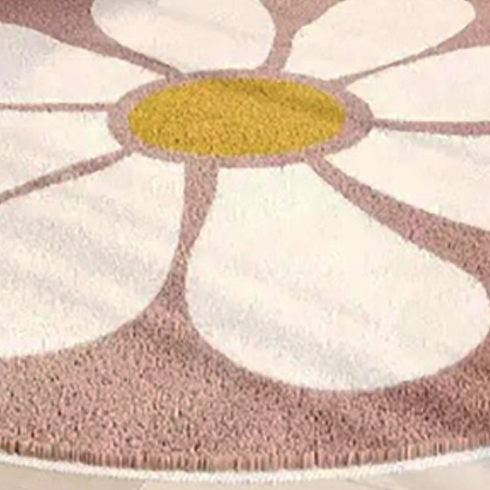 This vibrant, modern pink and white daisy rug will bring a cheerful touch to your child's playroom. Crafted from durable polyester fibers, it's soft to the touch and perfect for creating a cozy atmosphere. The perfect companion for your little one's bedroom or cloakroom, this kids' carpet will add a touch of fun and style to your home.