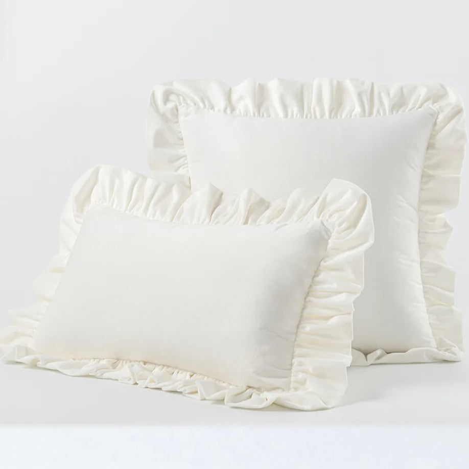 Enhance the aesthetic of your child's bedroom or playroom with a distinctive touch of modern and fun decor by incorporating this white ruffled throw pillow cover. Constructed from plush velvet, this decorative item provides opulent comfort and fashion. Elevate the ambiance of your room with this remarkable accent, offering both warmth and charm.