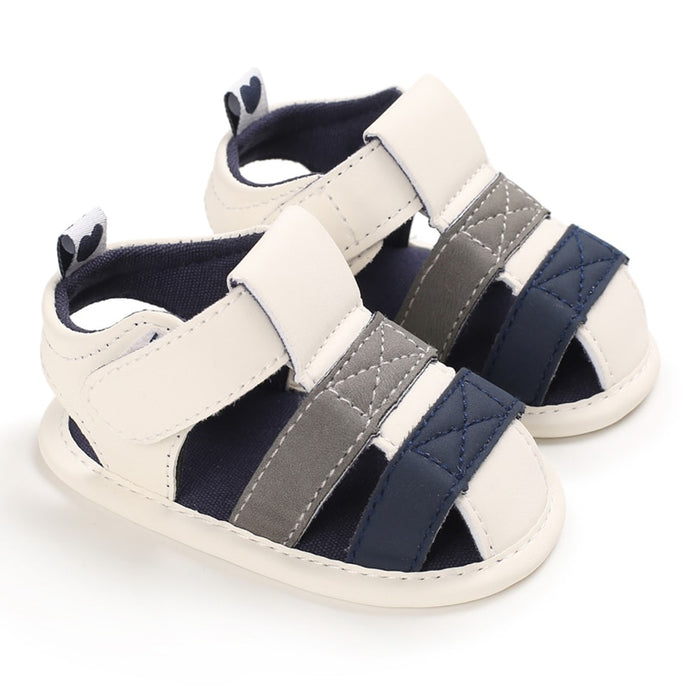 These adorable Summer beige, grey and blue sandals are designed to keep your little one's feet cool in the hot summer months! They come in multiple colors and sizes for newborns up to 18 months, so you'll be sure to find a pair for all your little one's summer adventures. Cute and comfy - it's a win-win! Upper Material: PU Leather. Outsole Material: Cotton. Heel Type: Flat. 