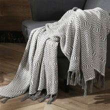 Load image into Gallery viewer, Wrap your child in the warmth and comfort of our soft grey knitted throw blanket! Crafted from lightweight material, this luxurious blanket will give your little one the restful sleep they deserve. Create a cozy space and make every night extra special with this perfect addition to your child&#39;s bedroom.
