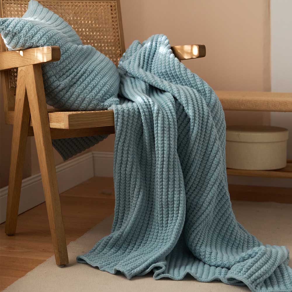 Bring the warmth of cozy comfort into your kid's bedroom with this soft, ocean blue knitted throw blanket! Crafted from light weight material, your little one can snuggle up in luxurious softness for a better night's sleep.  Size: 50 x 62 inches (127cm x 157cm) Material: 100% High Quality Acrylic Machine Wash: Color separate in a gentle cold water cycle. Tumble dry low, Low iron.