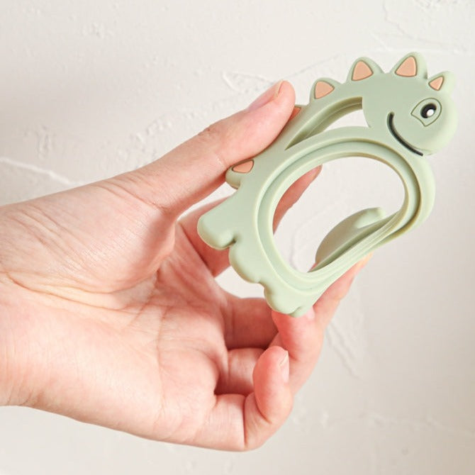 Dinosaur silicone teether for your little baby or toddler. this teether is great for kids ages 6 months to 3 years. And don't forget it is a cute gift too!