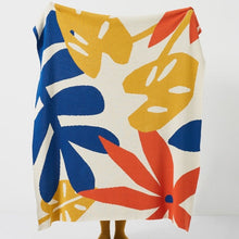 Load image into Gallery viewer, Wrap your little one up in the warmth and beauty of this Tropical Leaves Knitted Blanket. Featuring vivid shades of blue, orange and yellow, this cozy throw is sure to bring a cheerful splash of color to any bedroom or nursery. Keep your child snug and stylish with this decorative lullaby of knitted warmth.  Size: 51.18 x 62.99 inches (130cm x 160cm) Material: 100% co
