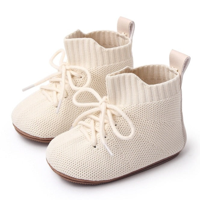 These breathable baby booties keep little feet cozy and comfortable, while allowing for natural movement. Perfect for kids newborn to 18 months, available in three colors – beige, black, and pink – these booties are a must-have for any parent! Get yours today and keep your baby's feet safe! Material: Cotton . Outsole Material: Rubber. Closure Type: Elastic Band.