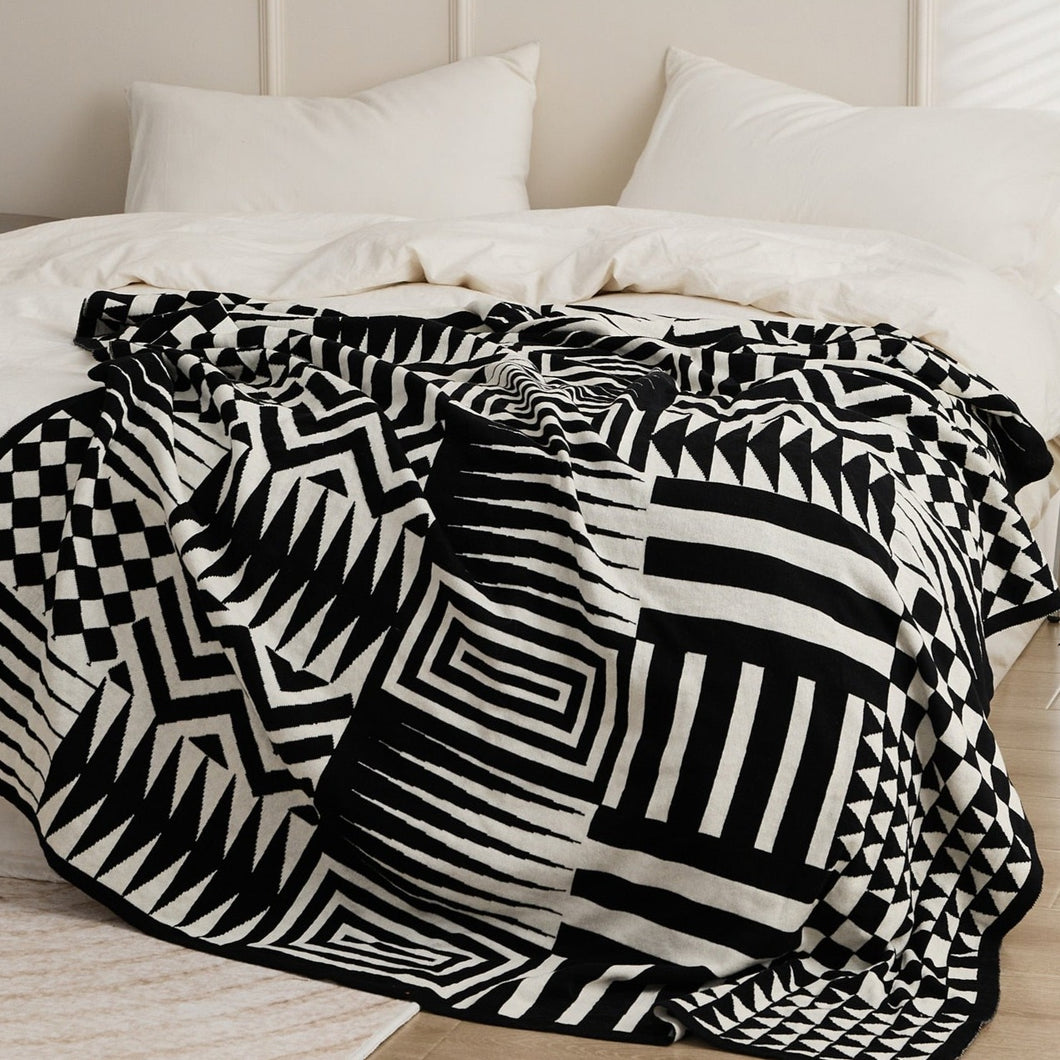 This ultra-cute geometric blanket is exactly what your kid's bedroom needs to be bursting with vibrancy! Keep 'em snug and stylish with this cozy knitted throw that's available in beautiful black and white. Snuggle up!  Size: 51.18 x 62.99 inches (130cm x 160cm) Material: 100% cotton Feature: Anti-pilling.