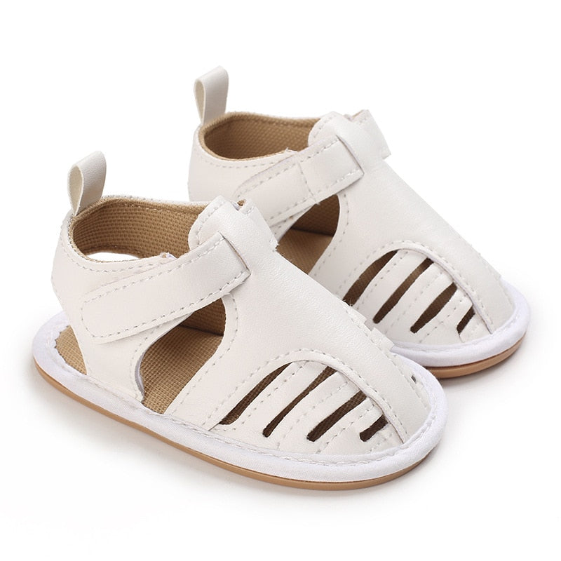 Give your baby's feet the royal treatment with beige baby sandals! Soft and flexible, these beautiful sandals come in an array of colors to suit any style. Offering baby-perfect fit and comfort, they provide extra stability and support their growing feet. Treat your baby to a touch of luxury with Milan Baby Sandals!  Upper Material: Cotton  Outsole Material: Rubber Heel Type: Flat 