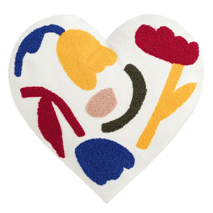 Surround your kid's room in love with this delightful white floral heart-shaped pillow! Hand-embroidered with cheerful details, its soft fabric provides cozy comfort. Transform the atmosphere of any bedroom or playroom with this charming accent! Size: 17.71 x 17.71 inches (45cm x 45cm) Material: Cotton and Polyester  Filling: Fiber