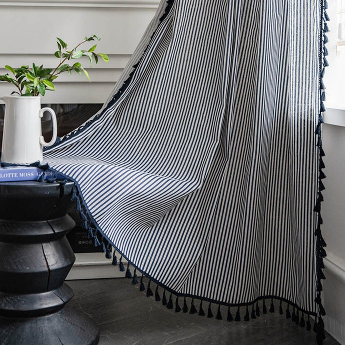 Transform your living space with this navy blue striped curtain panel! Its unique tassel pattern adds texture and depth, while the light-filtering yarn-dyed shading rate of 41% allows for a cozy light level. Available in multiple sizes and easy to install—let the fun begin! Machine washable for easy maintenance.