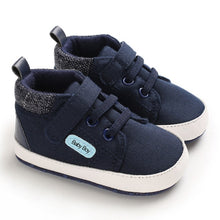 Load image into Gallery viewer, Super cool navy blue sneakers for your new baby or first time walker. Soft sole and anti-slip. These canvas shoes are for babies ages newborn to 18 months and come in blue, beige, brown and grey. Free Shipping.
